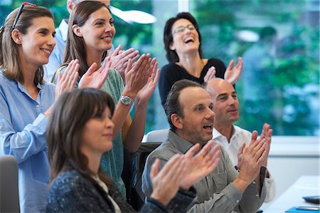 female presentation - Businesspeople applauding Stock Photo - Premium Royalty-Free, Code: 649-07736690