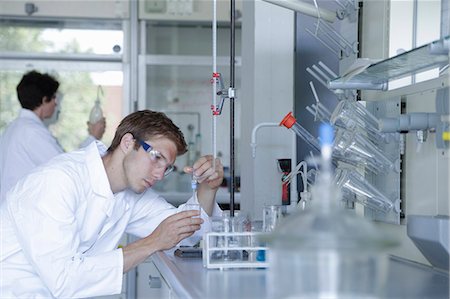 Male and female scientists working in lab Stock Photo - Premium Royalty-Free, Code: 649-07736706