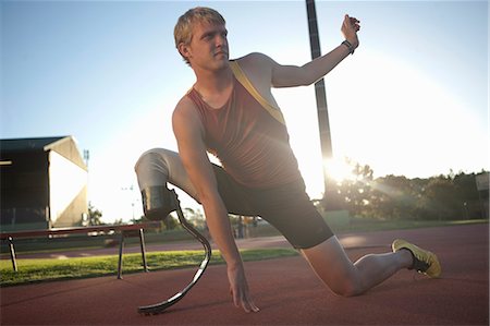 disability - Sprinter stretching Foto de stock - Sin royalties Premium, Código: 649-07736750