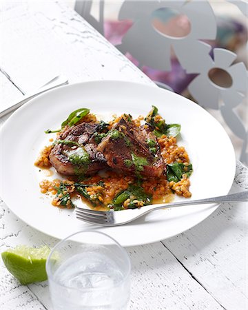 simsearch:649-07239058,k - Plate of red lentils with lamb chops and herb garnish Foto de stock - Sin royalties Premium, Código: 649-07736776