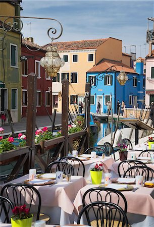 Multi colored houses and sidewalk restaurant, Burano, Venice, Veneto, Italy Stock Photo - Premium Royalty-Free, Code: 649-07736894