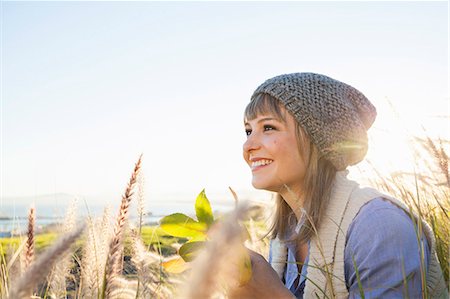 Young woman enjoying view in fields Stock Photo - Premium Royalty-Free, Code: 649-07737006