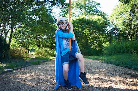 Young boy in fancy dress, on zip wire Photographie de stock - Premium Libres de Droits, Code: 649-07760855