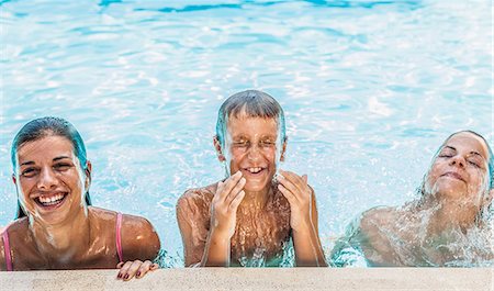friends swimming - Portrait of boy and two sisters in swimming pool Stock Photo - Premium Royalty-Free, Code: 649-07760961