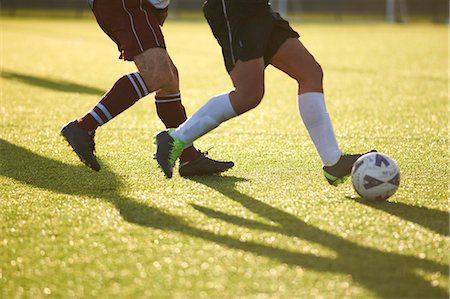 Footy players fighting for ball Stock Photo - Premium Royalty-Free, Code: 649-07760987