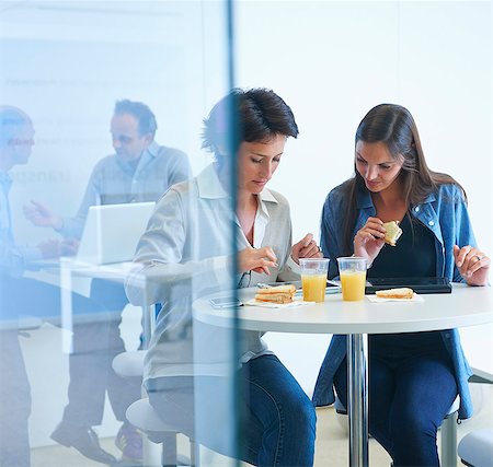 simsearch:649-07761045,k - Business people having discussion over lunch Stock Photo - Premium Royalty-Free, Code: 649-07761018