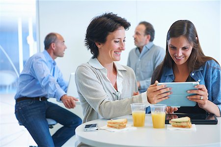 simsearch:649-07761045,k - Business people having discussion over lunch Stock Photo - Premium Royalty-Free, Code: 649-07761019