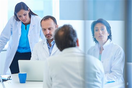 scientist laptop - Group of researchers having meeting Stock Photo - Premium Royalty-Free, Code: 649-07761012