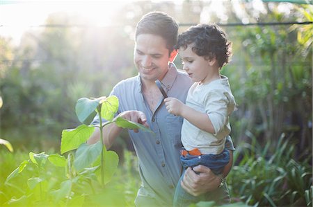 simsearch:649-07761188,k - Mid adult man and son looking at plants in allotment Stock Photo - Premium Royalty-Free, Code: 649-07761162