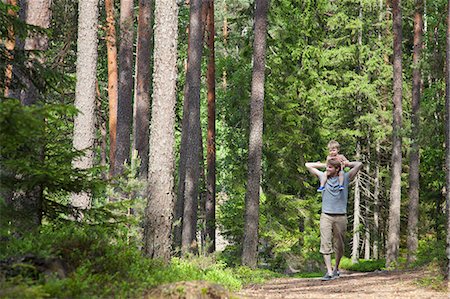 father son forest casual clothing two caucasian - Father shoulder carrying toddler son through forest, Somerniemi, Finland Stock Photo - Premium Royalty-Free, Code: 649-07761255