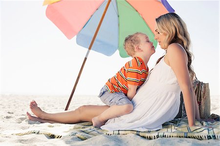 sandy beach - Mid adult mother and son picnic blanket at beach, Cape Town, Western Cape, South Africa Stock Photo - Premium Royalty-Free, Code: 649-07804098