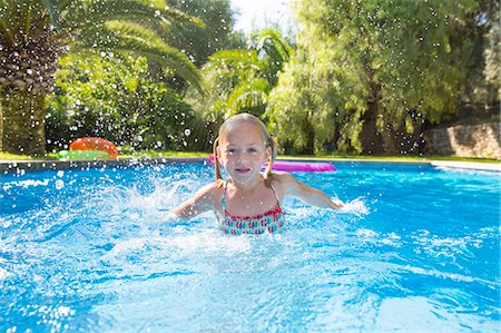 simsearch:649-05949971,k - Girl swimming in garden swimming pool Stock Photo - Premium Royalty-Free, Code: 649-07804168