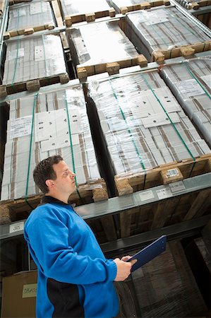 simsearch:649-07804440,k - Factory worker checking pallets Stock Photo - Premium Royalty-Free, Code: 649-07804425