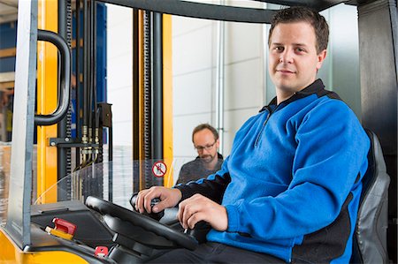 simsearch:649-06812498,k - Factory worker operating forklift Stock Photo - Premium Royalty-Free, Code: 649-07804429