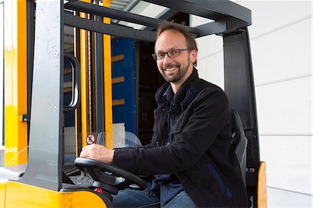 simsearch:649-07804440,k - Factory worker operating forklift Stock Photo - Premium Royalty-Free, Code: 649-07804432
