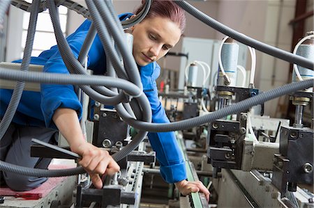 simsearch:649-07804440,k - Factory worker working machinery Stock Photo - Premium Royalty-Free, Code: 649-07804446