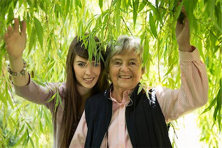 Grandmother and granddaughter under willow tree Stock Photo - Premium Royalty-Free, Code: 649-07804478