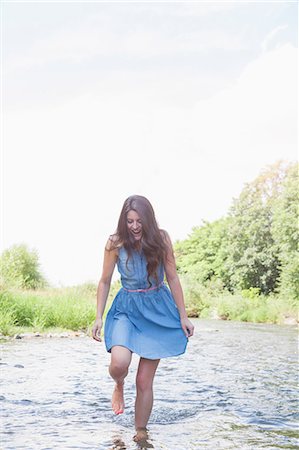 simsearch:649-07804544,k - Young woman in shallow stream Stock Photo - Premium Royalty-Free, Code: 649-07804540