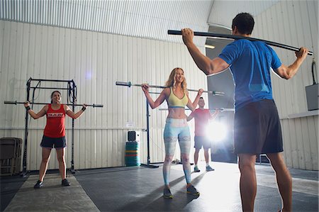 sport smiles - Crossfitters working out with bar in group class Stock Photo - Premium Royalty-Free, Code: 649-07804601