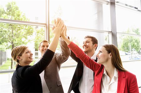 successful team - Businessmen and businesswomen cheering Stock Photo - Premium Royalty-Free, Code: 649-07804769