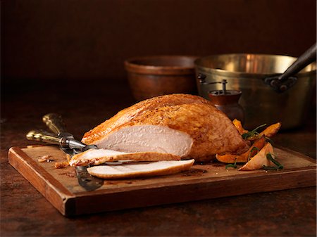 simsearch:649-08144231,k - Christmas dinner. Organic roasted turkey breast on chopping board Stock Photo - Premium Royalty-Free, Code: 649-07804850