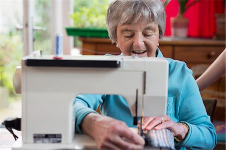 Senior woman using sewing machine Stock Photo - Premium Royalty-Free, Code: 649-07804923