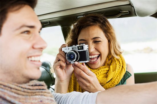 Young woman photographing boyfriend whilst driving, Cape Town, Western Cape, South Africa Stock Photo - Premium Royalty-Free, Image code: 649-07803275