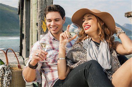 Young couple drinking wine on old pier, Cape Town, Western Cape, South Africa Stock Photo - Premium Royalty-Free, Code: 649-07803293