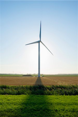 rilland - Wind turbine in front of sunrise in field landscape, Rilland, Zeeland, the Netherlands Stock Photo - Premium Royalty-Free, Code: 649-07803367