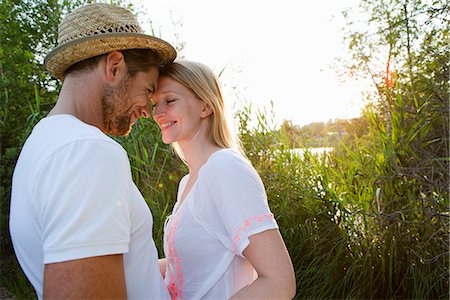 sunlight lake - Romantic mid adult couple at lakeside Stock Photo - Premium Royalty-Free, Code: 649-07803457