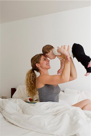 simsearch:649-01621440,k - Mother holding baby boy up in mid air Stock Photo - Premium Royalty-Free, Code: 649-07803517