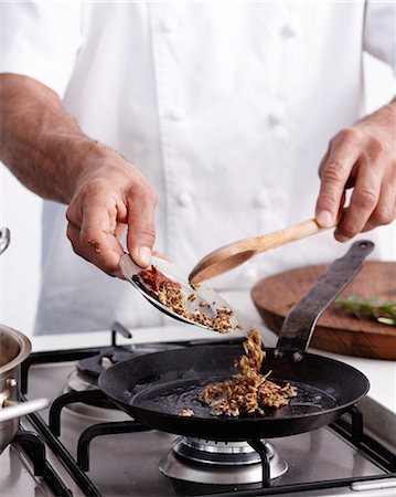 picture of people cooking in frying pan - How to Make Curry Step 09 Stock Photo - Premium Royalty-Free, Code: 649-07803673