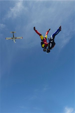 simsearch:700-03333697,k - Team of two female skydivers in head down position over Buttwil, Luzern, Switzerland Stock Photo - Premium Royalty-Free, Code: 649-07803766