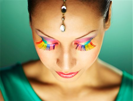 Young woman with jewel head accessory and coloured eyelashes Stock Photo - Premium Royalty-Free, Code: 649-07904918