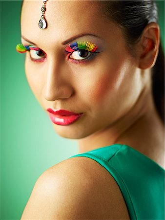 Young woman with jewel head accessory and coloured eyelashes Stock Photo - Premium Royalty-Free, Code: 649-07904919