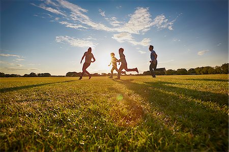 picture of 50 year old man running - Family out in the park Stock Photo - Premium Royalty-Free, Code: 649-07905122