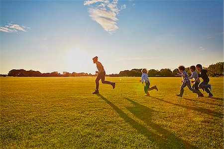 family outdoor lens flare - Family enjoying outdoor activities in the park Stock Photo - Premium Royalty-Free, Code: 649-07905123