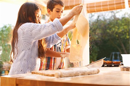 Children making dough in kitchen Stock Photo - Premium Royalty-Free, Code: 649-08004020