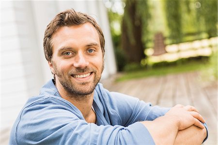 portrait 30s man not woman - Close up portrait of mid adult man sitting on porch Stock Photo - Premium Royalty-Free, Code: 649-08004068