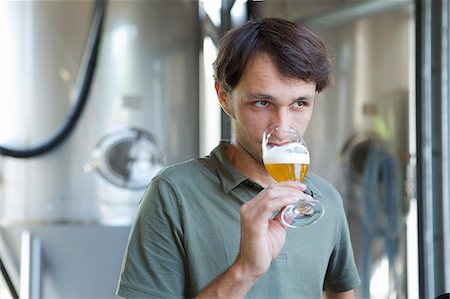 food industry people not restaurant - Male brewer tasting glass of beer Stock Photo - Premium Royalty-Free, Code: 649-08004335