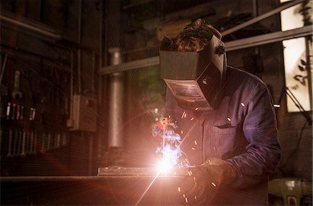 Welder soldering iron in workshop Stock Photo - Premium Royalty-Free, Code: 649-08003998