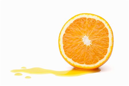 Halved orange with juice Foto de stock - Royalty Free Premium, Número: 649-08060138