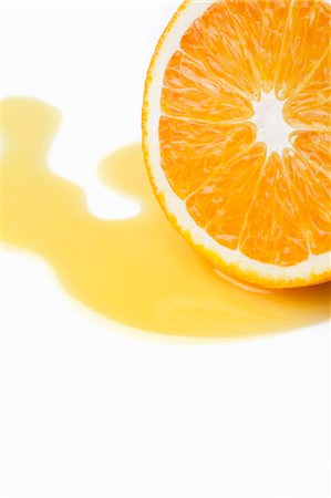 Halved orange with juice Foto de stock - Sin royalties Premium, Código: 649-08060139