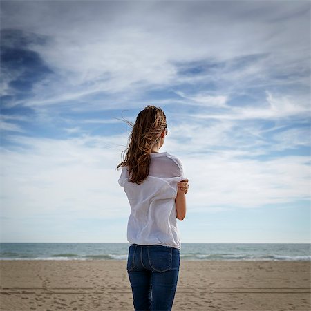 simsearch:649-07709901,k - Rear view of mid adult woman looking out to sea, Castelldefels, Catalonia, Spain Stock Photo - Premium Royalty-Free, Code: 649-08060185