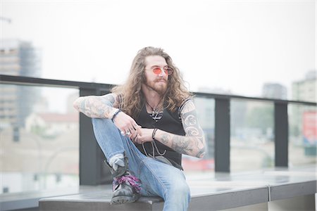 simsearch:649-08060336,k - Portrait of young man with long hair and sunglasses Stock Photo - Premium Royalty-Free, Code: 649-08060326