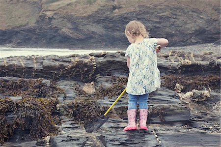 simsearch:614-07806392,k - Female toddler fishing in rock pools on beach, Crackington Haven, Cornwall, UK Stock Photo - Premium Royalty-Free, Code: 649-08060363