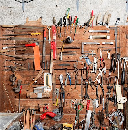 rustic workshop - Variety of hand tools displayed on workshop wall Stock Photo - Premium Royalty-Free, Code: 649-08060409