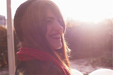 red scarf woman - Portrait of woman wearing red scarf and black hat Stock Photo - Premium Royalty-Free, Code: 649-08060500