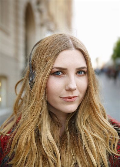 Portrait of blond young woman with headphones Stock Photo - Premium Royalty-Free, Image code: 649-08084537