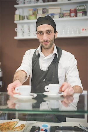 simsearch:649-07238688,k - Barista serving coffee over the counter Stock Photo - Premium Royalty-Free, Code: 649-08084556